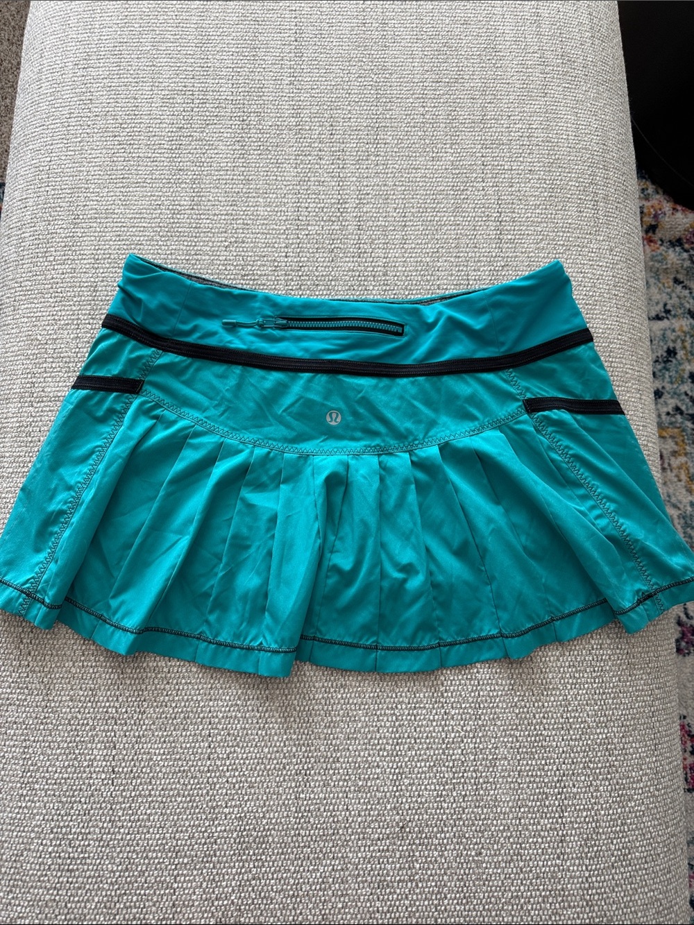 lululemon athletica turquoise pleated skater skirt with black trim